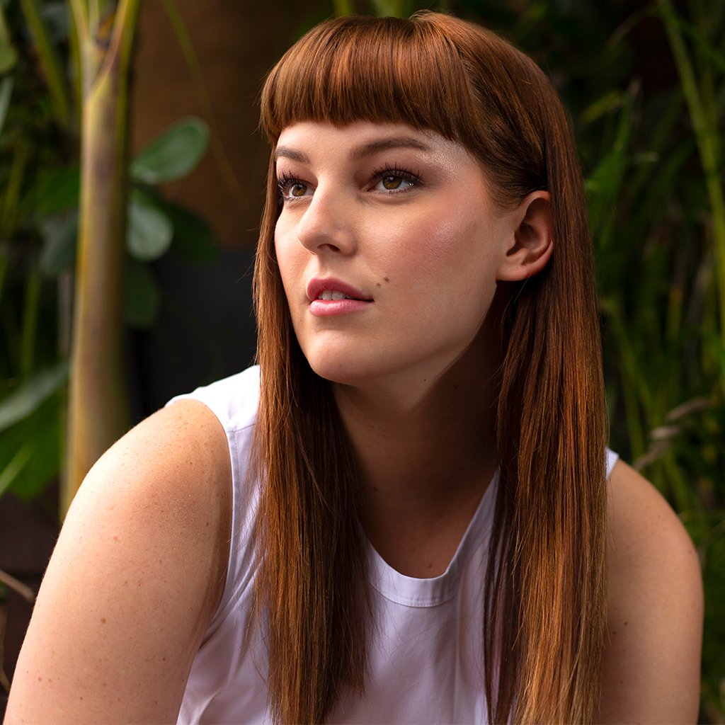 Women showing her red hair after using Color Full Conditioner