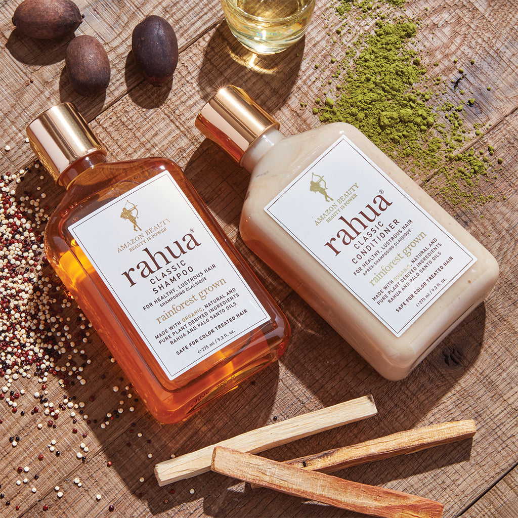 Rahua Classic Shampoo and classic conditioner bottle with natural ingredients including rahua seeds and Palo santo stick