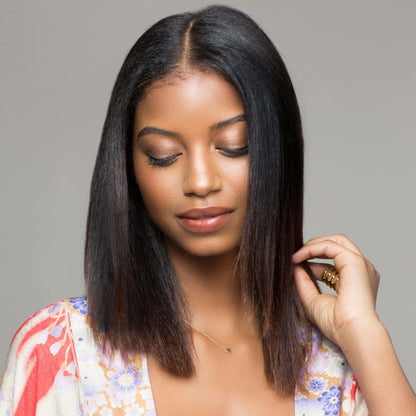 woman with silky straight hair after using rahua oil