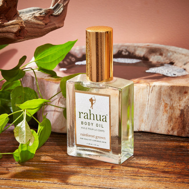 Rahua Body Oil Bottle on Wooden Floor