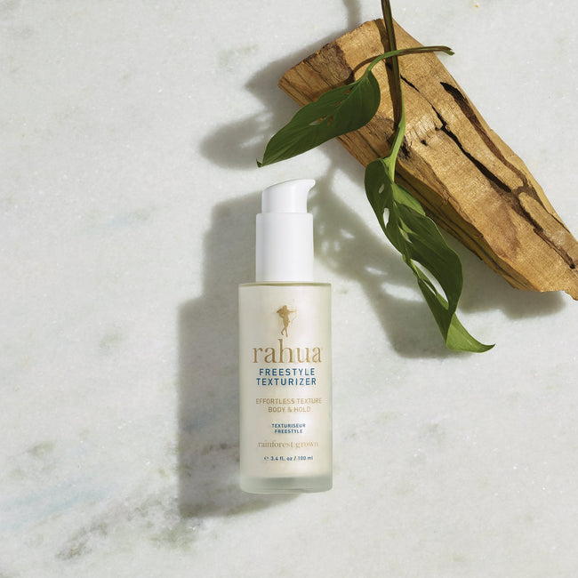 Rahua Freestyle Texturizer bottle with palo Santo Stick and Carnauba Leaves