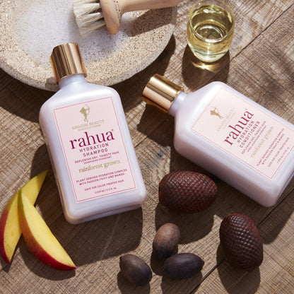 rahua hydration shampoo and conditioner bottle with natural ingredients including Morete seeds, mango slice, rahua seeds, oil