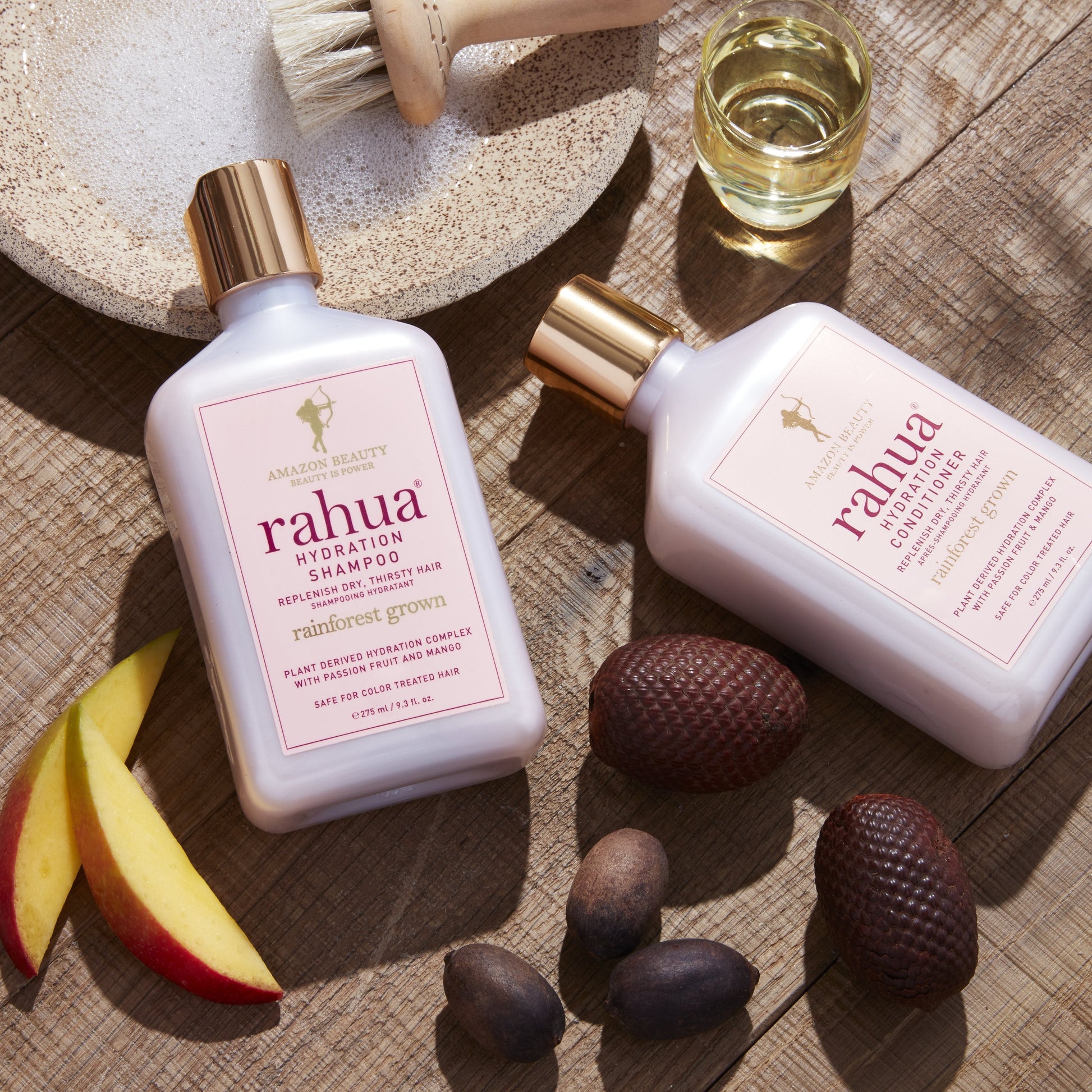 rahua hydration shampoo and conditioner bottle with natural ingredients including Morete seeds, mango slice, rahua seeds