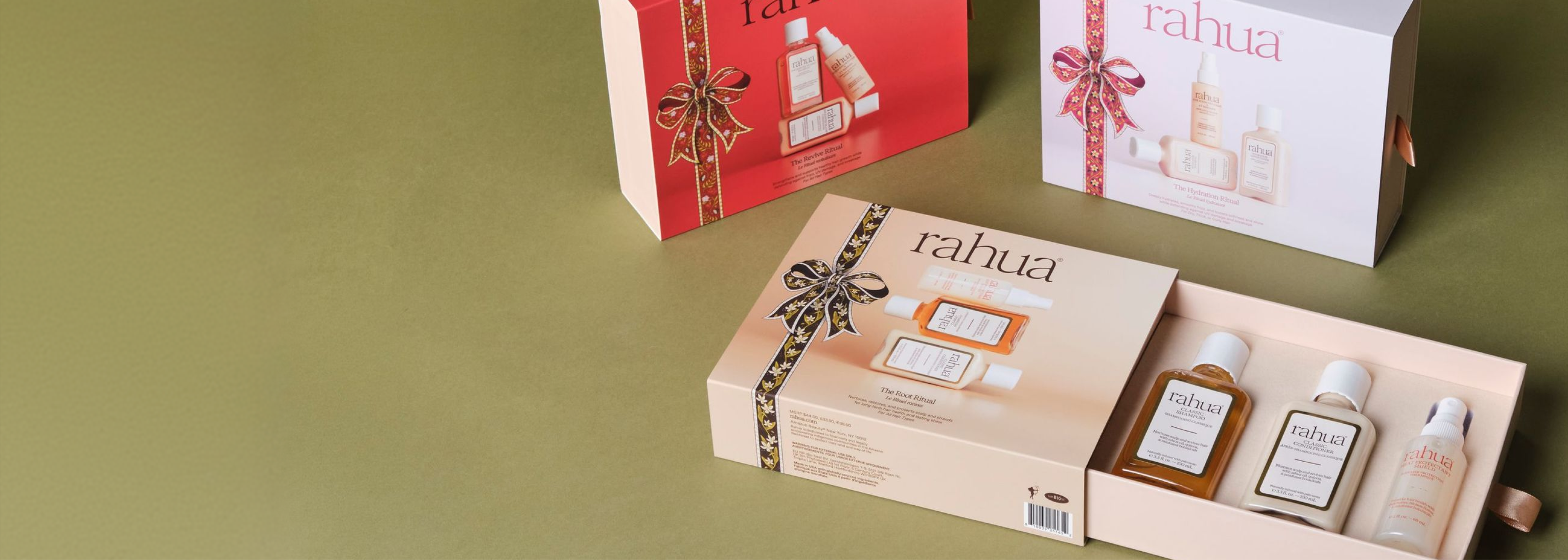Rahua holiday ritual gift kits with an open Root Ritual box